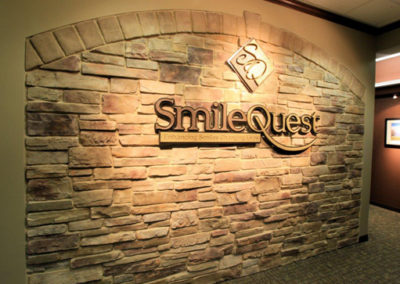 rock wall smile quest sign
